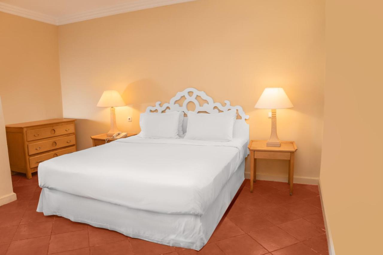 Sharm Dreams Vacation Club - Aqua Park Hotel Exterior photo A bed with a bed skirt