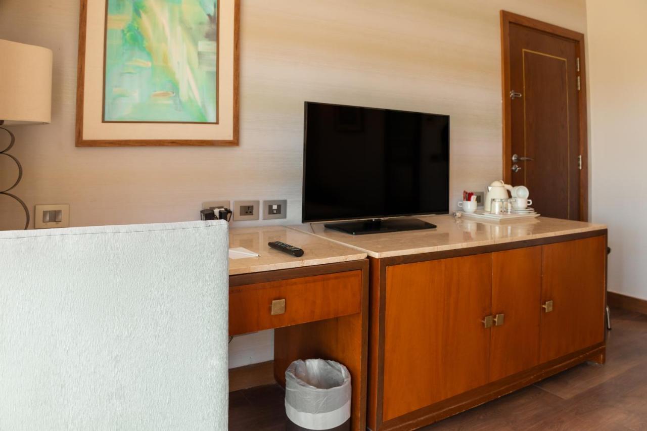 Sharm Dreams Vacation Club - Aqua Park Hotel Exterior photo A television in a hotel room