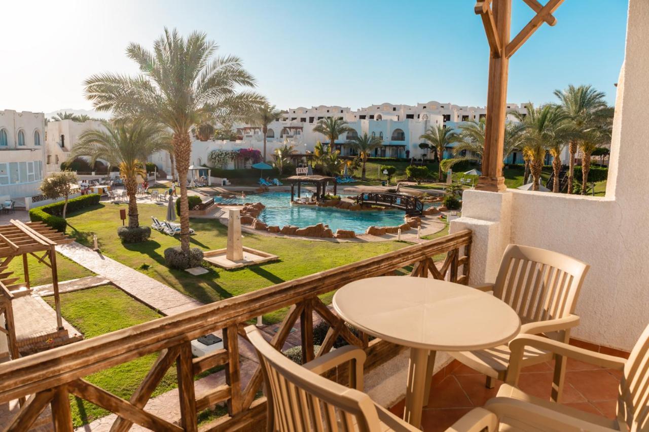 Sharm Dreams Vacation Club - Aqua Park Hotel Exterior photo View of the pool at the Hilton Sharm El Sheikh
